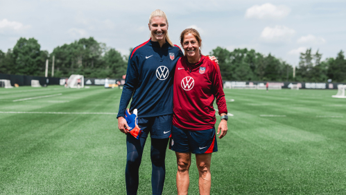 Casey Murphy (left) and Denise Reddy standing together side by side on the field 