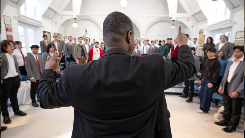 Brandon Williams, Director of Choral Activities and Conductor of the Rutgers Glee Club, directs a rehearsal at McKinney Hall.