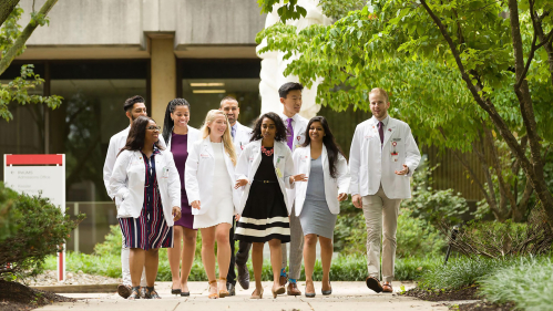 Rutgers health students walking on campus