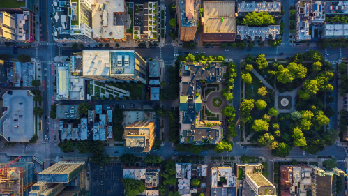 Aerial view of city with parks interspersed