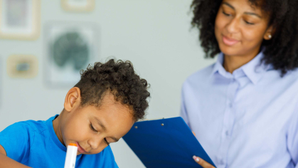 Psychologist with a student at school