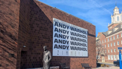 A banner hung outside the Zimmerli Art Museum touts the new Andy Warhol exhibition at Rutgers.