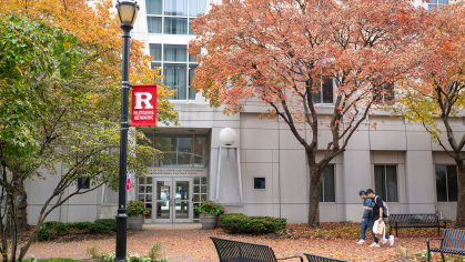 Students walk on plaza outside the School of Public Affairs and Administration, and Center for Urban and Public Service on the Newark campus in the fall.