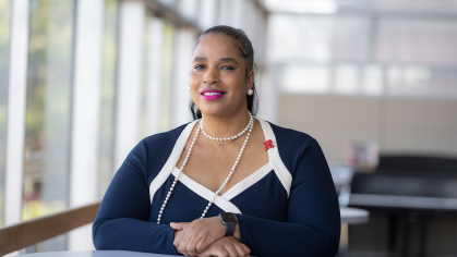 Karima Woodyard, Director, Student Involvement and Leadership, seated at a table