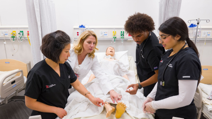 Rutgers school of nursing students practice in class