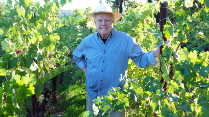 Rich Moran standing in a vineyard