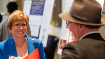 Rutgers alumna and donor Sandra Lanman, left, speaks with Rutgers School of Social Work Dean George Leibowitz