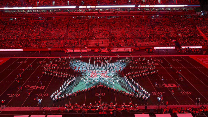 Marching band in formation of Hamilton Star