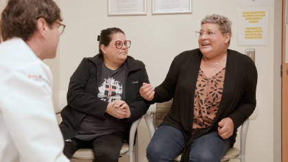 Maria Pascale and her sister Maria Durante sit in an exam room with Rutgers oncologist Christian Hinrichs. Courtesy of Rutgers Cancer Institute