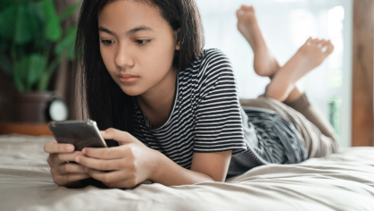 teen stares at phone