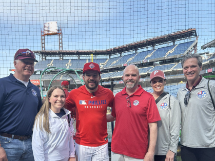 Alumni Bob White (left) and Mark O'Connor (right) with his wife, Susan, and Philadelphia Phillies player Kyle Schwarber (center), a supporter of the Families Behind the Badge Children’s Foundation