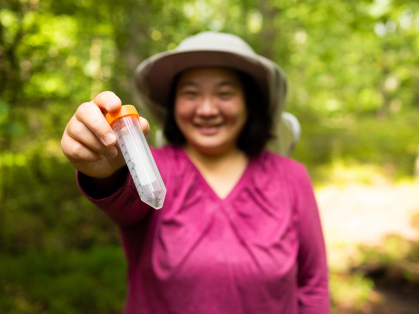 a researcher holding a stopper