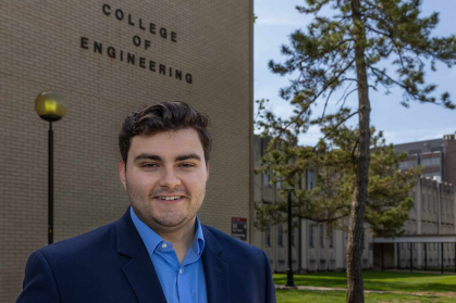 Doug Doyle stands outside a School of Engineering building on Busch campus.