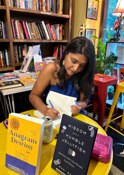 Rutgers alumna Grishma Shah signs her debut novel, Anagram Destiny, at a recent discussion