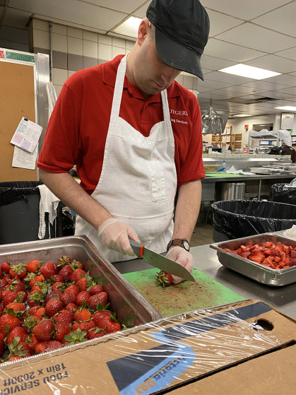Chris cutting strawberries