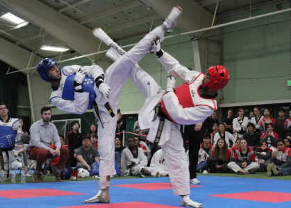 Malik Dobson cancels his opponent's kick during a competition earlier this year.