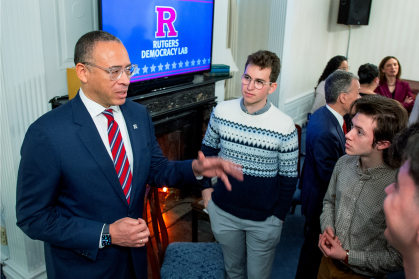 President Jonathan Holloway talks to students during the Democracy Lab event