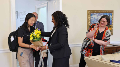 Julianne Chan (left) is surprised by Rutgers–New Brunswick Chancellor Francine Conway on winning a Udall Undergraduate Scholarship as J.D. Bowers, dean of the Honors College, and Anne Wallen, director of the Office of Distinguished Fellowships, join in on the celebration.