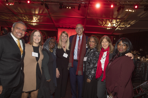 guests pose with President Holloway